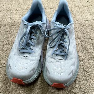 Women’s Hoka sneakers size 9D. Light blue with orange accents.